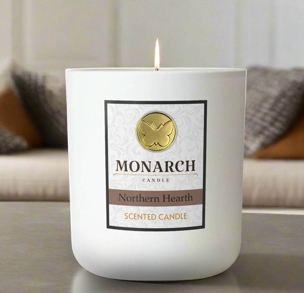 Monarch Candle labeled “Northern Hearth” glowing gently in a white luxury glass vessel against a warm indoor background.