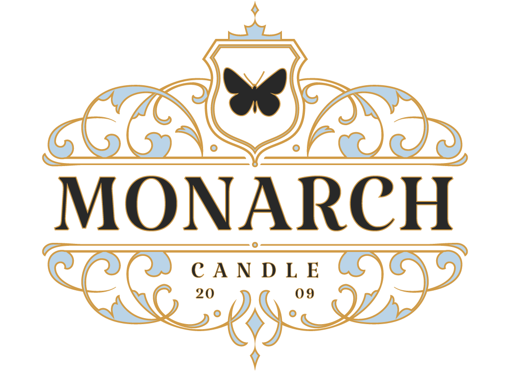 Monarch Candle Company logo featuring a monarch butterfly at the top, elegant swirl design, and “2009” establishing date.