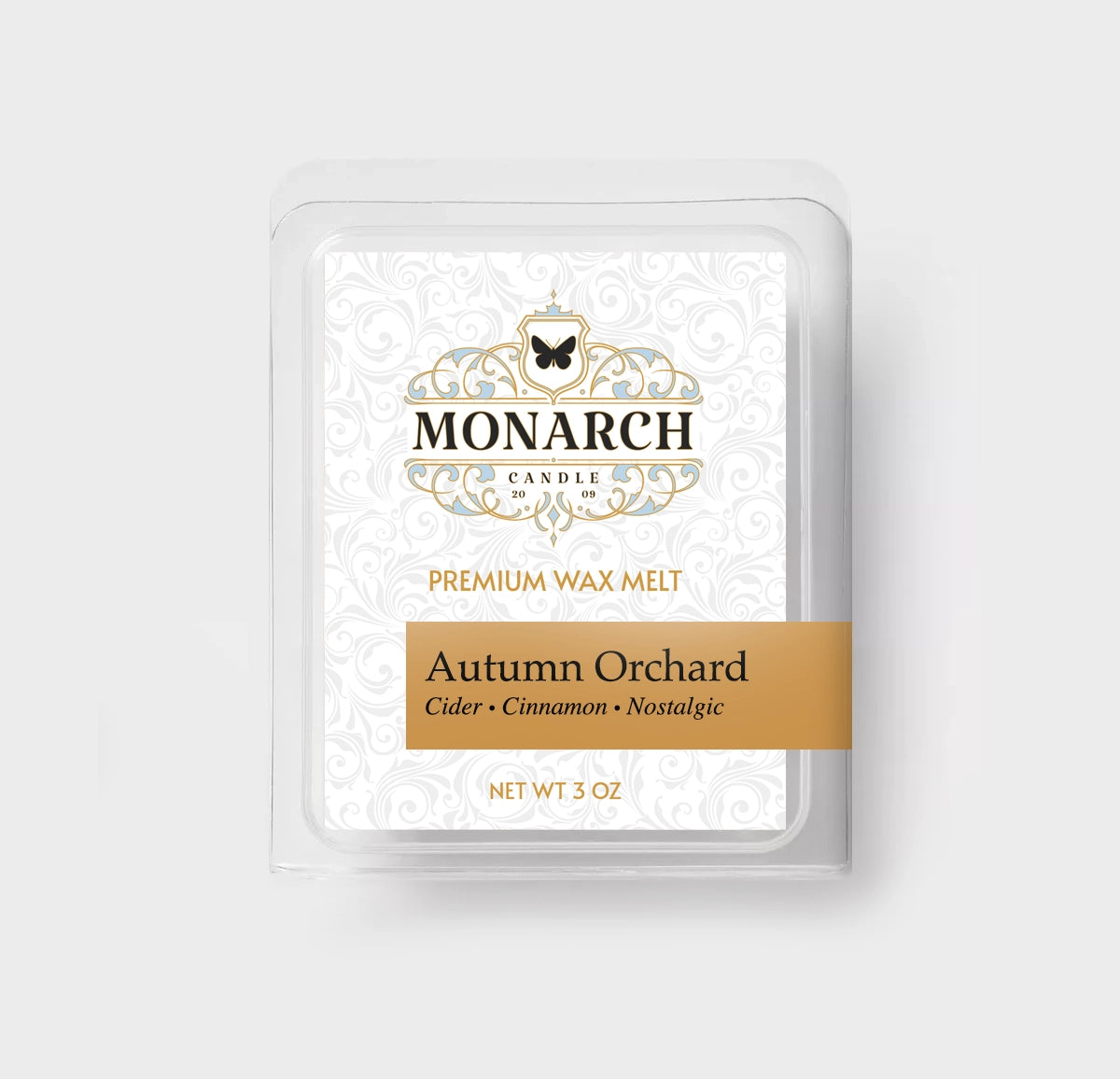Monarch Candle premium wax melt packaging labeled “Autumn Orchard” displayed on a neutral gray background.