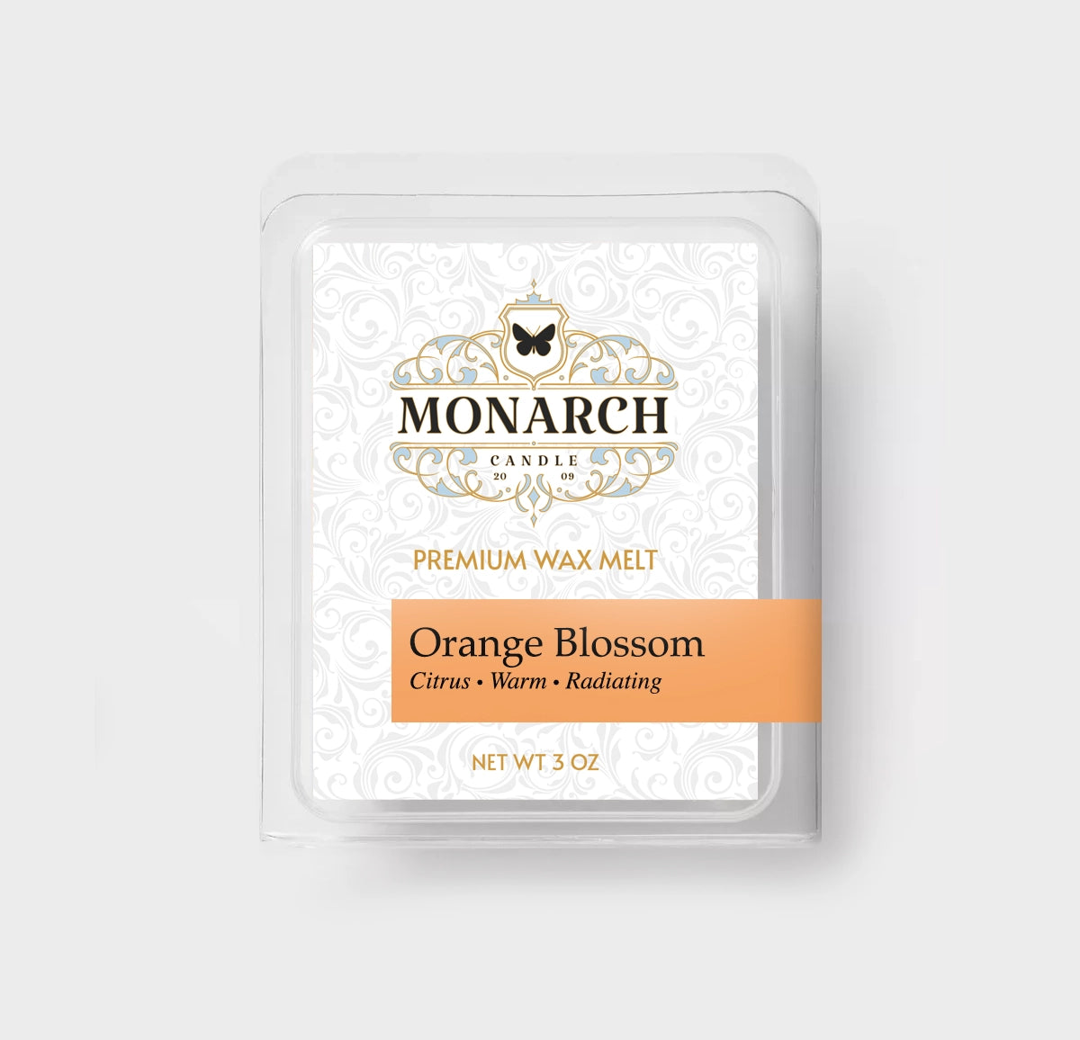 Monarch Candle premium wax melt packaging labeled “Orange Blossom” displayed on a neutral gray background.