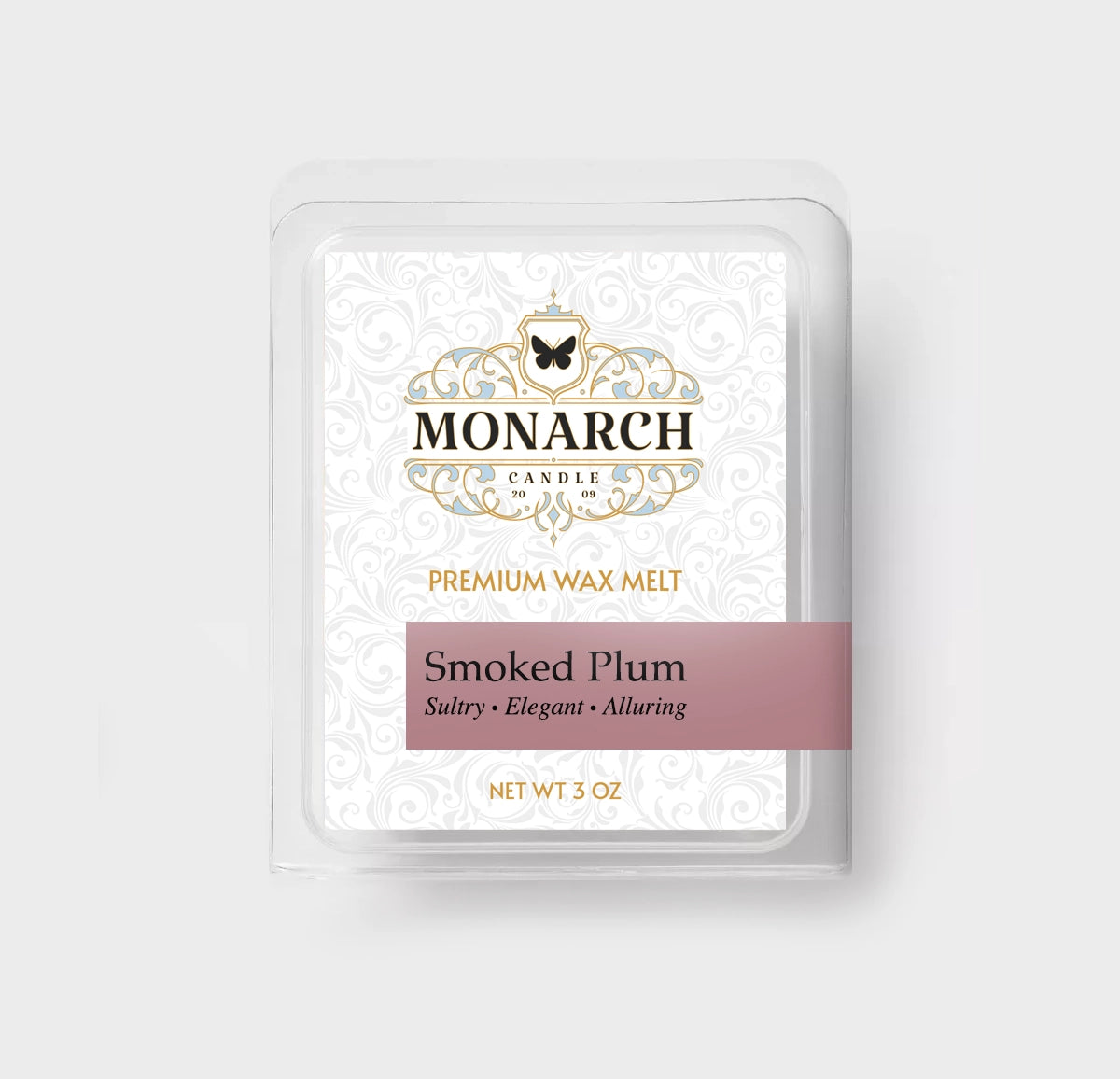 Monarch Candle premium wax melt packaging labeled “Smoked Plum” displayed on a neutral gray background.