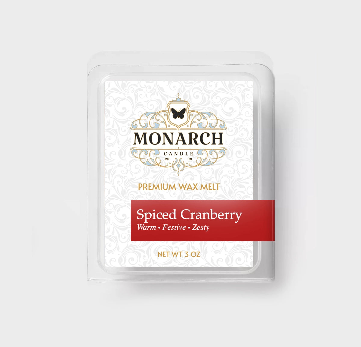 Monarch Candle premium wax melt packaging labeled “Spiced Cranberry” displayed on a neutral gray background.