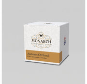 Monarch Candle votive box packaging labeled “Autumn Orchard” displayed on a neutral gray background.