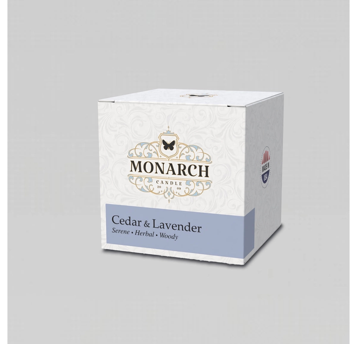 Monarch Candle votive box packaging labeled “Cedar & Lavender” displayed on a neutral gray background.