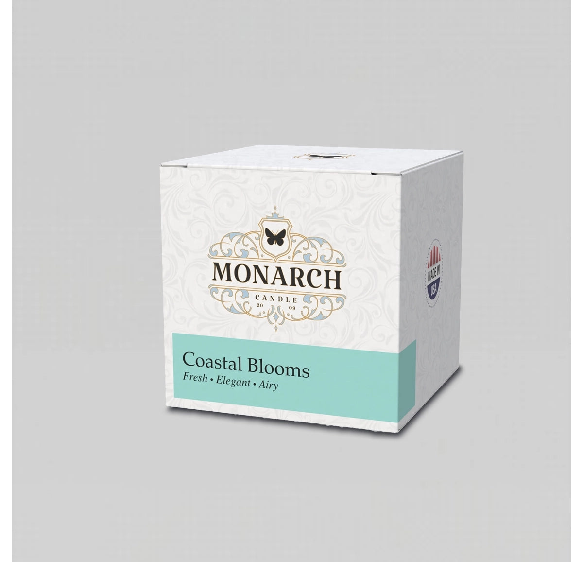 Monarch Candle votive box packaging labeled “Coastal Blooms” displayed on a neutral gray background.