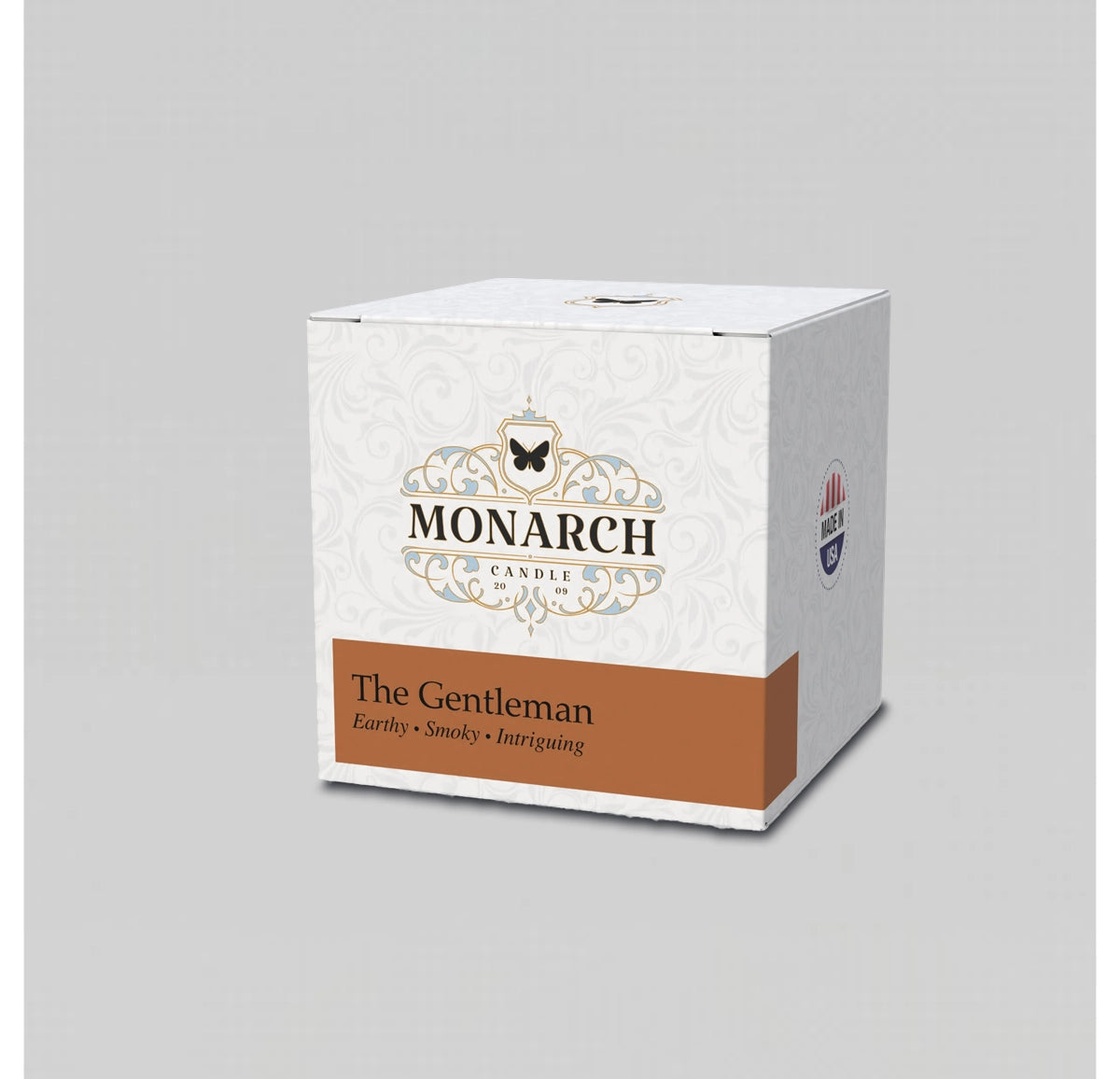Monarch Candle votive box packaging labeled “The Gentleman” displayed on a neutral gray background.