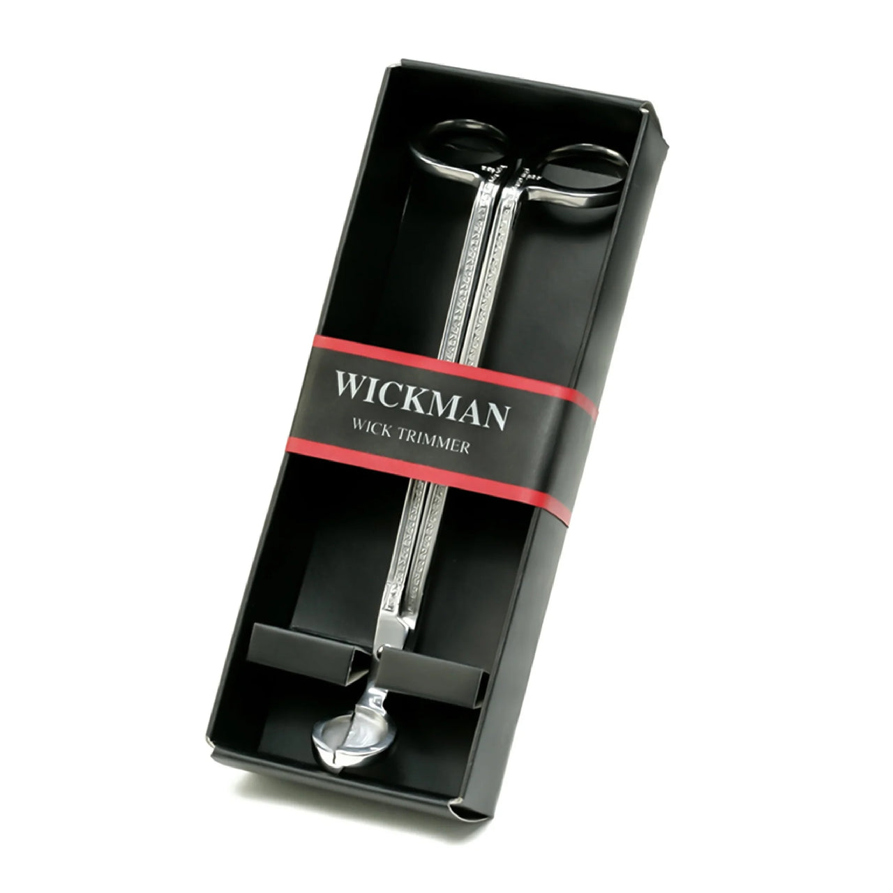 Wickman brand wick trimmer in pewter finish, displayed in its black packaging with on white background.